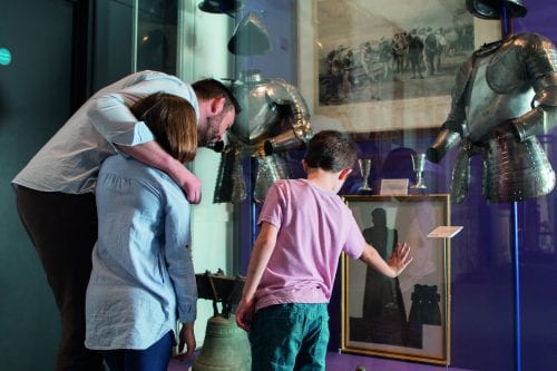Family Discovering a Historic Exhibition