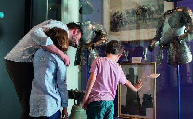 Family Discovering a Historic Exhibition
