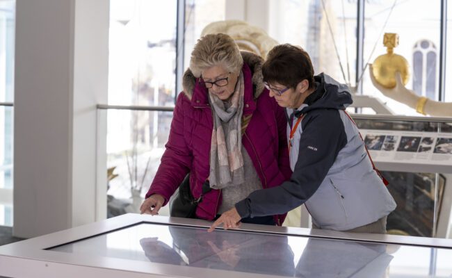 Two women look at an interactive display
