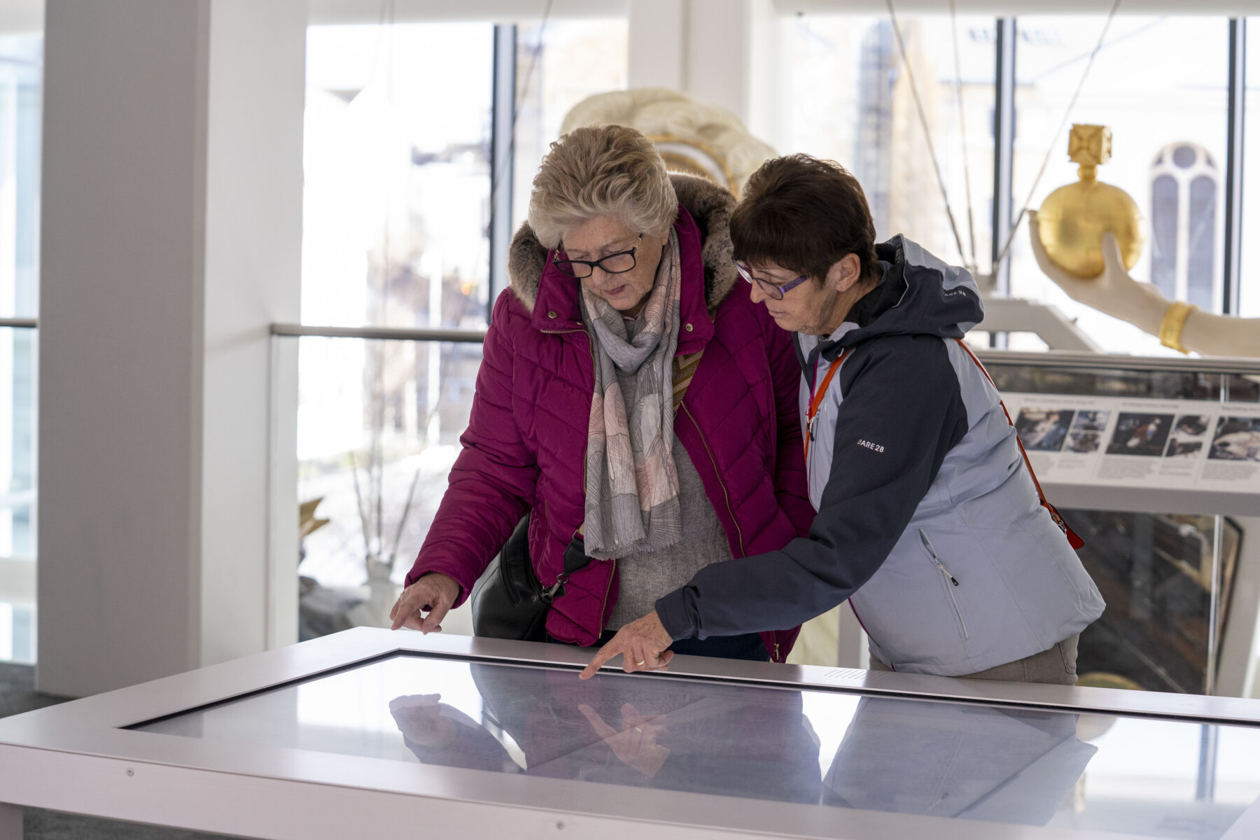 Two women look at an interactive display