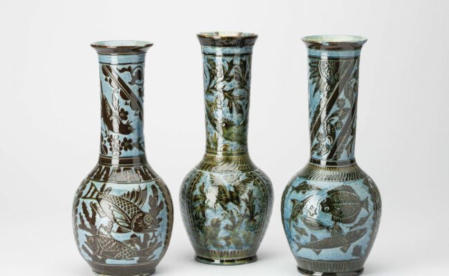 Three large ceramic vases with engraved fishes on them