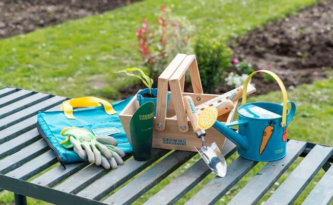 Children's gardening tools on bench