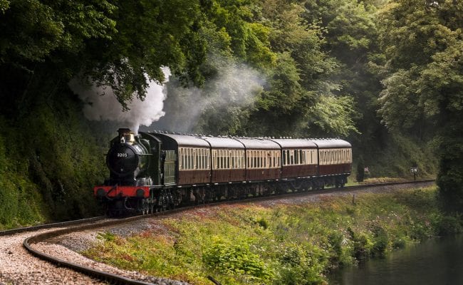 Train travelling on track on South Devon Railway