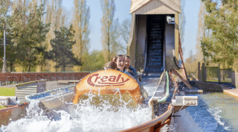 Family having fun and getting splashed on Tidal Wave log flume at Crealy 