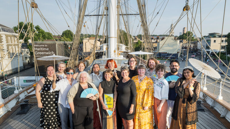 Members of staff from The Box Plymouth celebrate on the top deck of the Cutty Sark