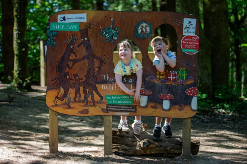 Children pose at a Stick Man-themed selfie frame