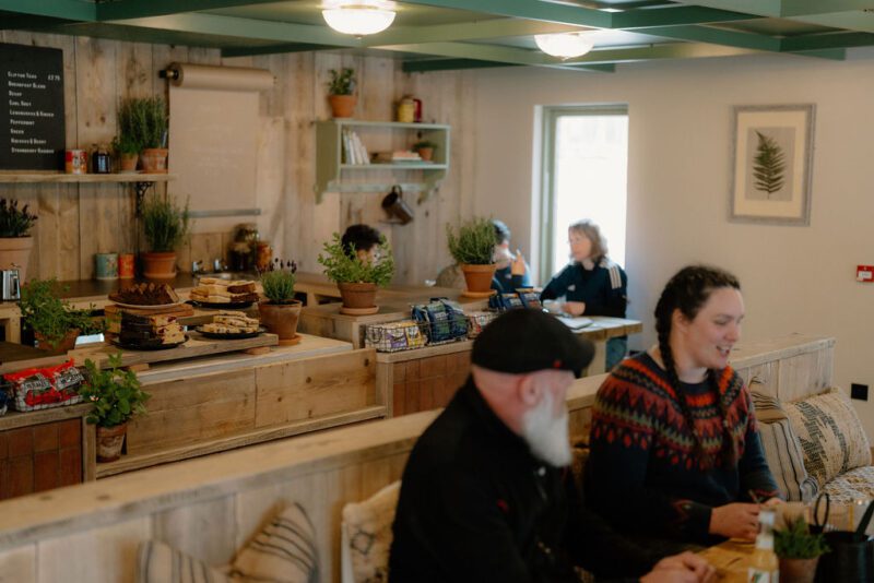 Diners in a rustically decorated cafe