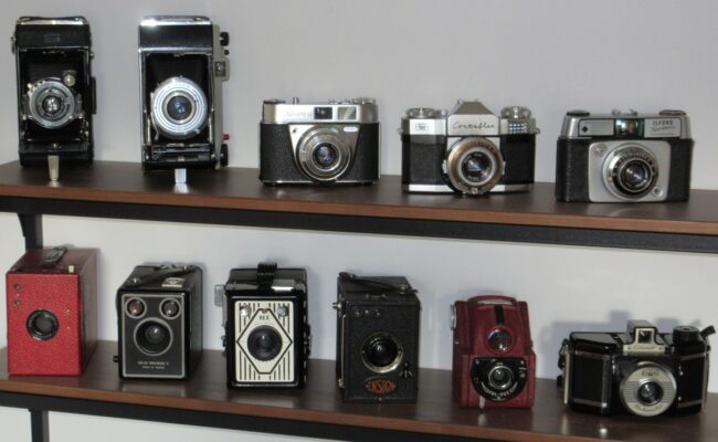 a collection of antique cameras