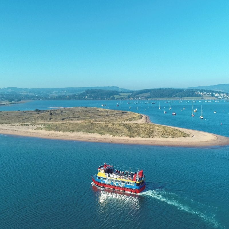 Boat crusing across the south devon coast